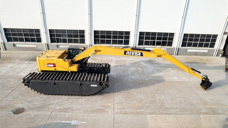 The combination of an amphibious undercarriage and a long reach boom